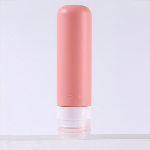 Dusty rose pink silicone travel bottle 100ml with rounded dome top standing upright on pure white background – main product image