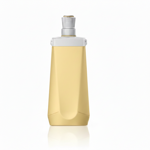 Golden yellow collapsible silicone water bottle folded completely flat showing compact size on white background