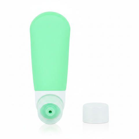 Mint green silicone travel bottle with bottom cap removed showing wide mouth opening for easy refilling on white background