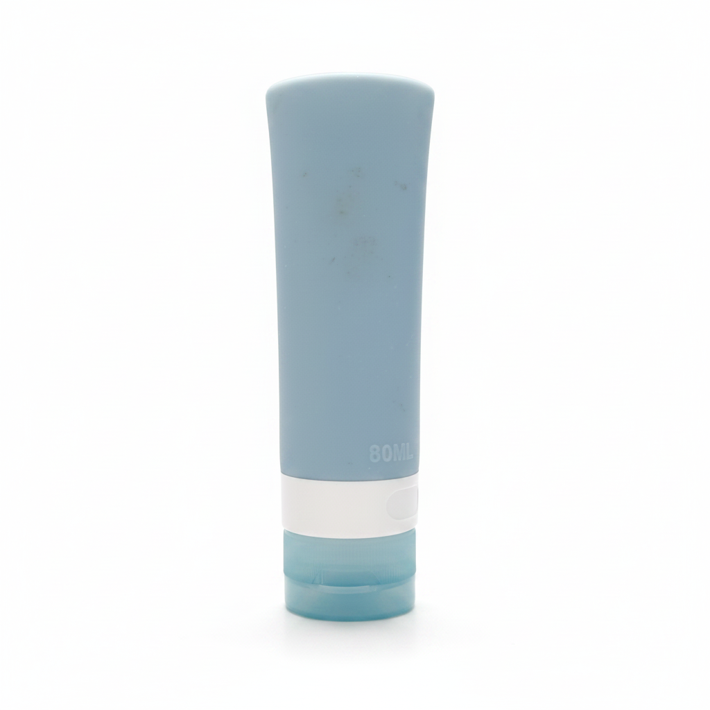 Portable travel silicone squeeze bottle slate blue front view on white background