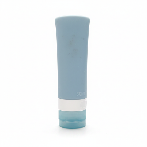 Portable travel silicone squeeze bottle slate blue front view on white background