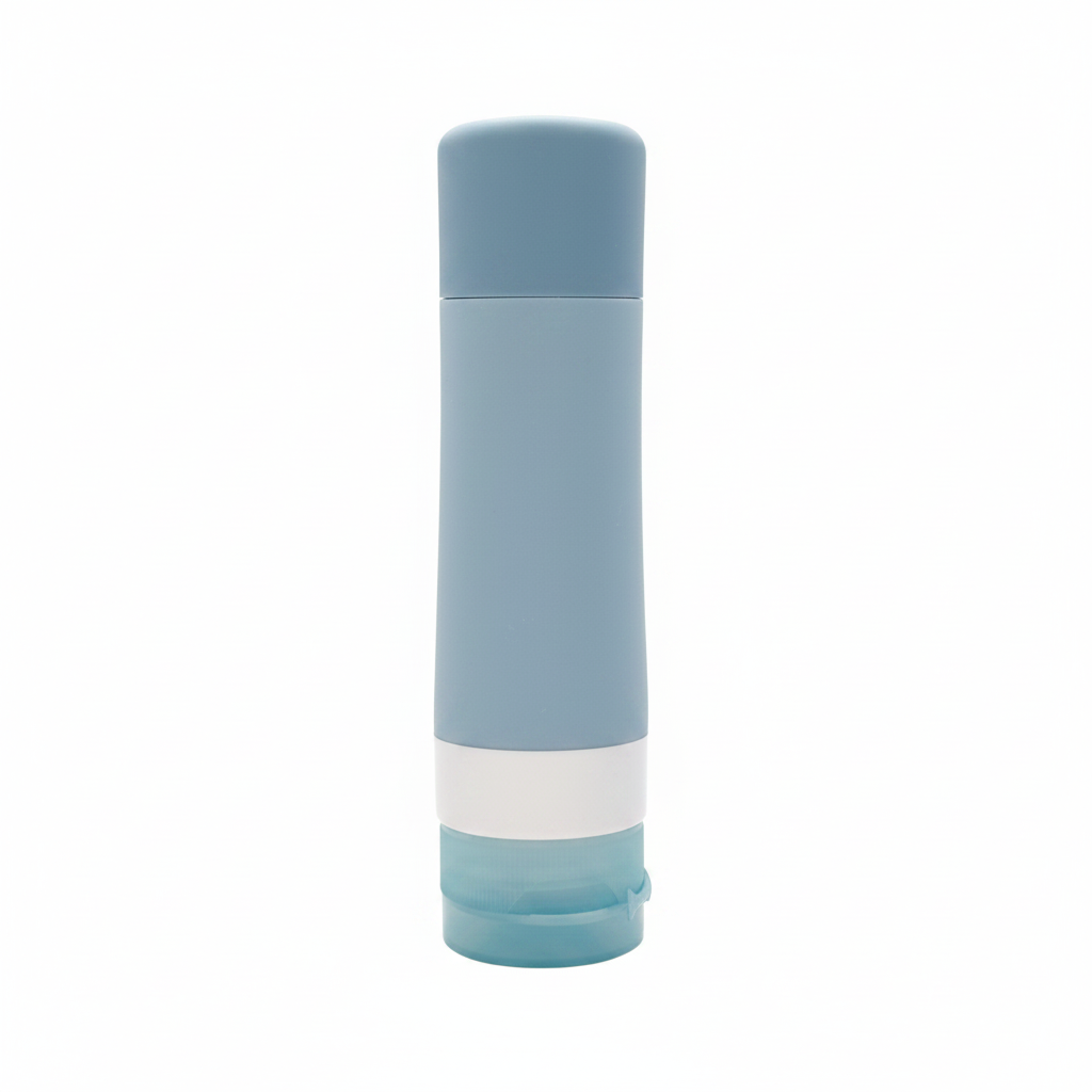 Portable travel silicone squeeze bottle with PP flip lid in slate blue on white background - professional product photo