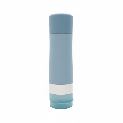 Portable travel silicone squeeze bottle with PP flip lid in slate blue on white background - professional product photo